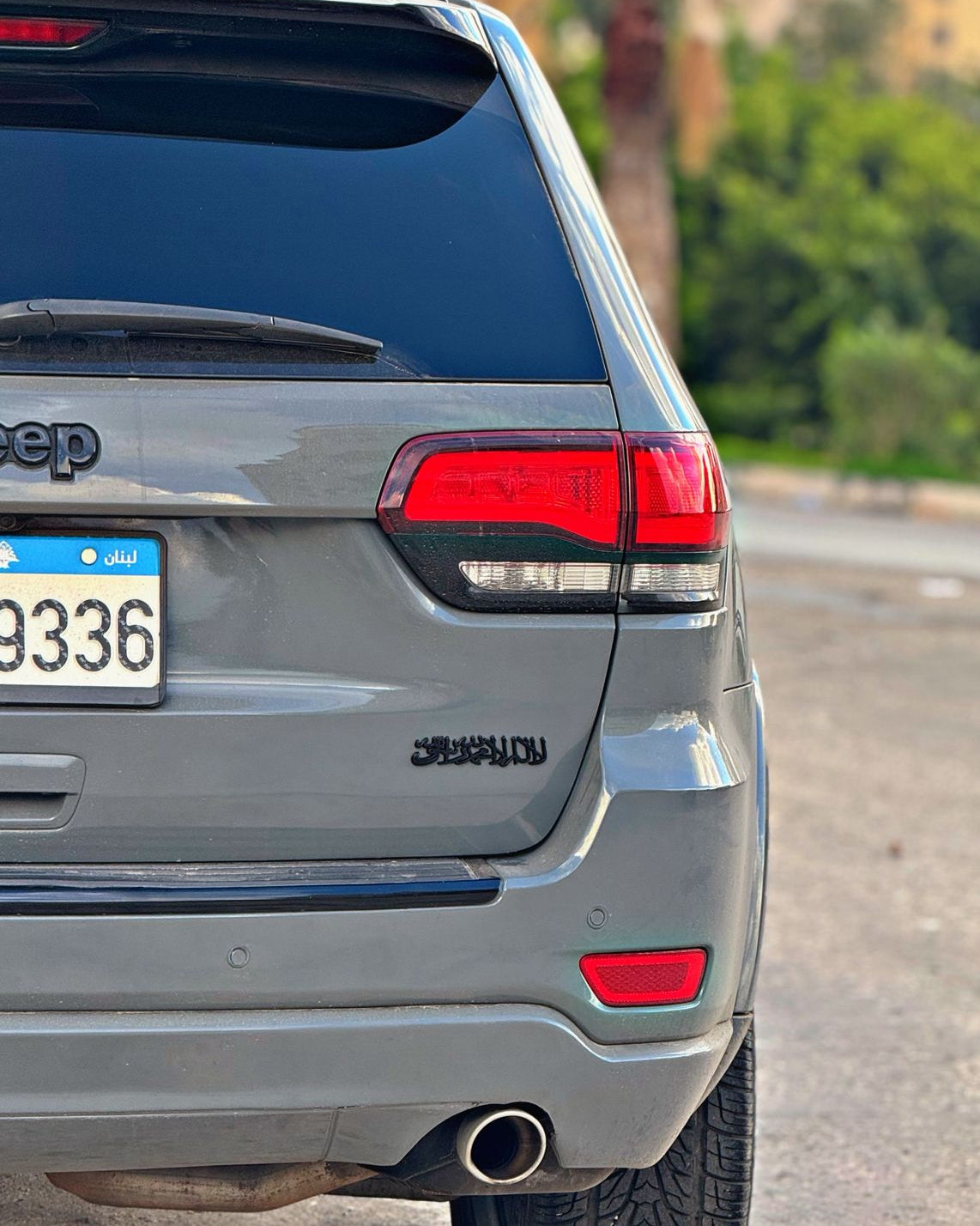 Back view of a Jeep Grand Cherokee with shahada emblem from qadar