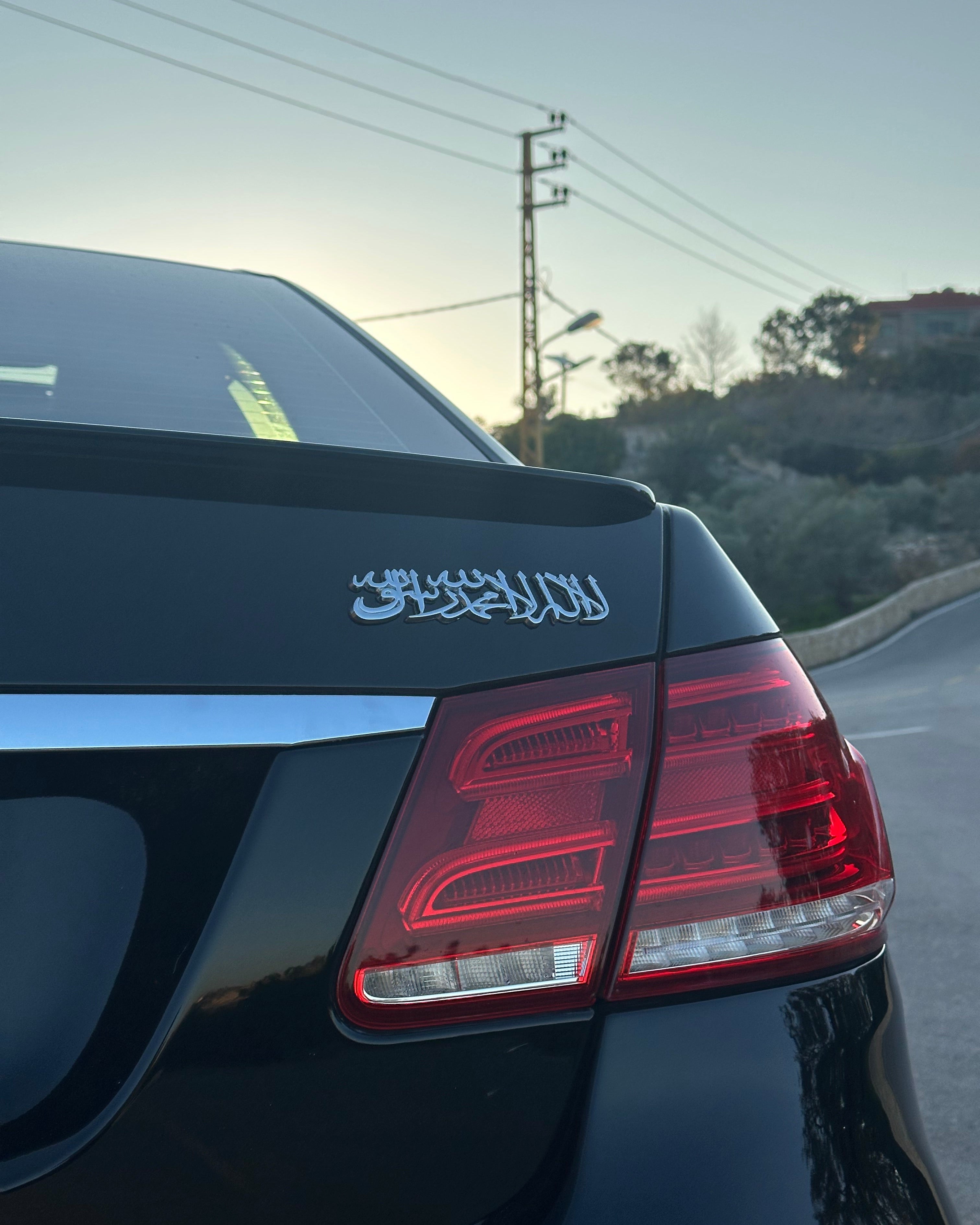 Close-up of a car with shahada emblem